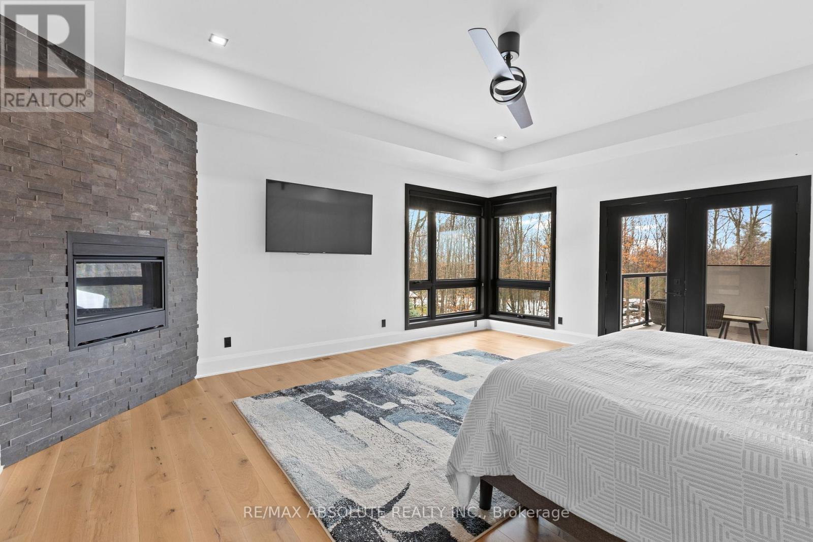 Large primary with fireplace! - 131 Cherryhill Drive, Ottawa, ON - Indoor Photo Showing Bedroom With Fireplace