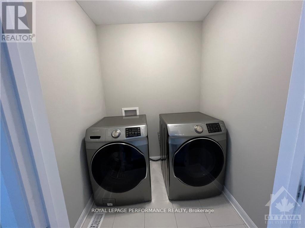 18 Gardenpost Terrace S, Ottawa, ON - Indoor Photo Showing Laundry Room