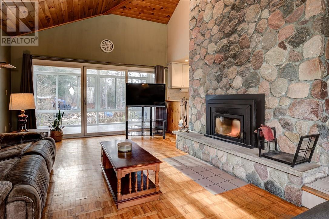 1767 Wallace Road, Chelmsford, ON - Indoor Photo Showing Living Room With Fireplace
