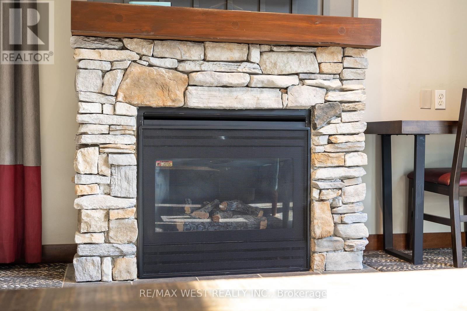 Living room fireplace (gas) - 232 - 152 Jozo Weider Boulevard, Blue Mountains, ON - Indoor Photo Showing Other Room With Fireplace
