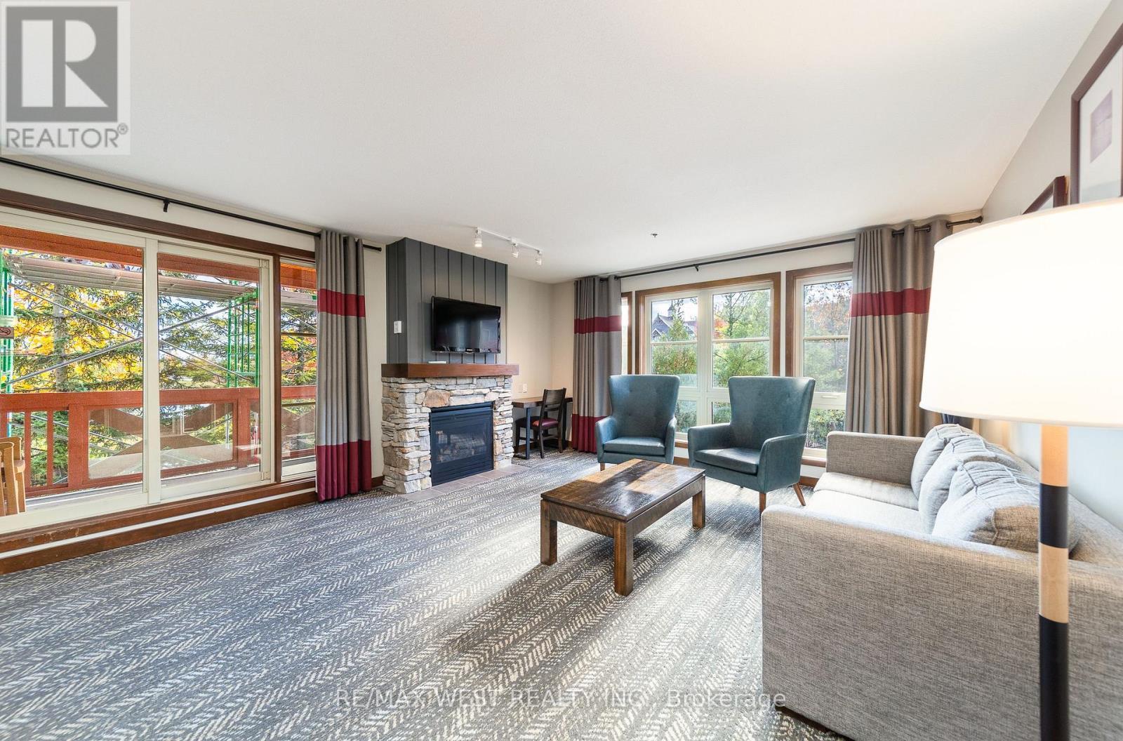 Living room - 232 - 152 Jozo Weider Boulevard, Blue Mountains, ON - Indoor Photo Showing Living Room With Fireplace