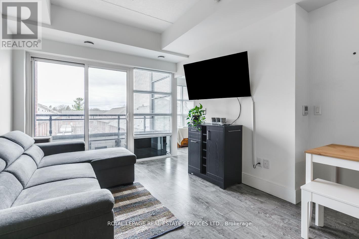 412 - 15 Prince Albert Boulevard, Kitchener, ON - Indoor Photo Showing Living Room With Fireplace