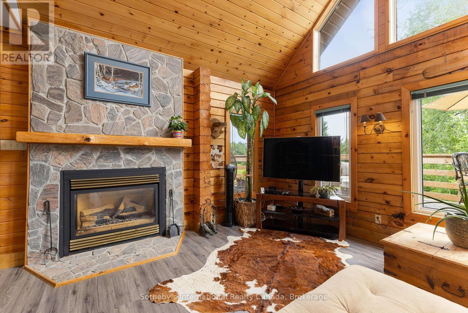 20 Kodiak Road, Mckellar, ON - Indoor Photo Showing Living Room With Fireplace