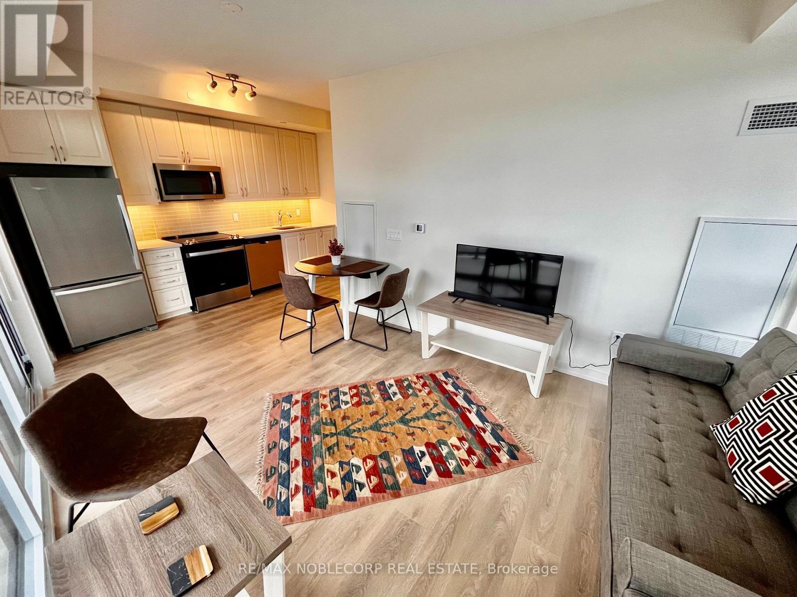 711 - 38 Annie Craig Drive, Toronto, ON - Indoor With Fireplace