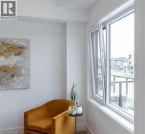 Sitting room featuring baseboards -