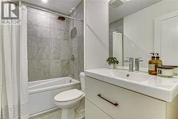 Full bathroom featuring shower / tub combo, vanity, and tile patterned floors -