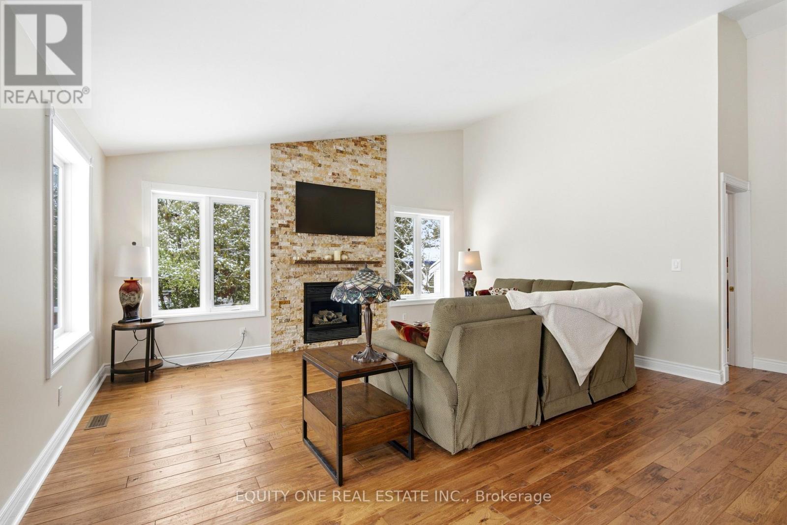 17 Savage Drive, Ottawa, ON - Indoor Photo Showing Living Room With Fireplace