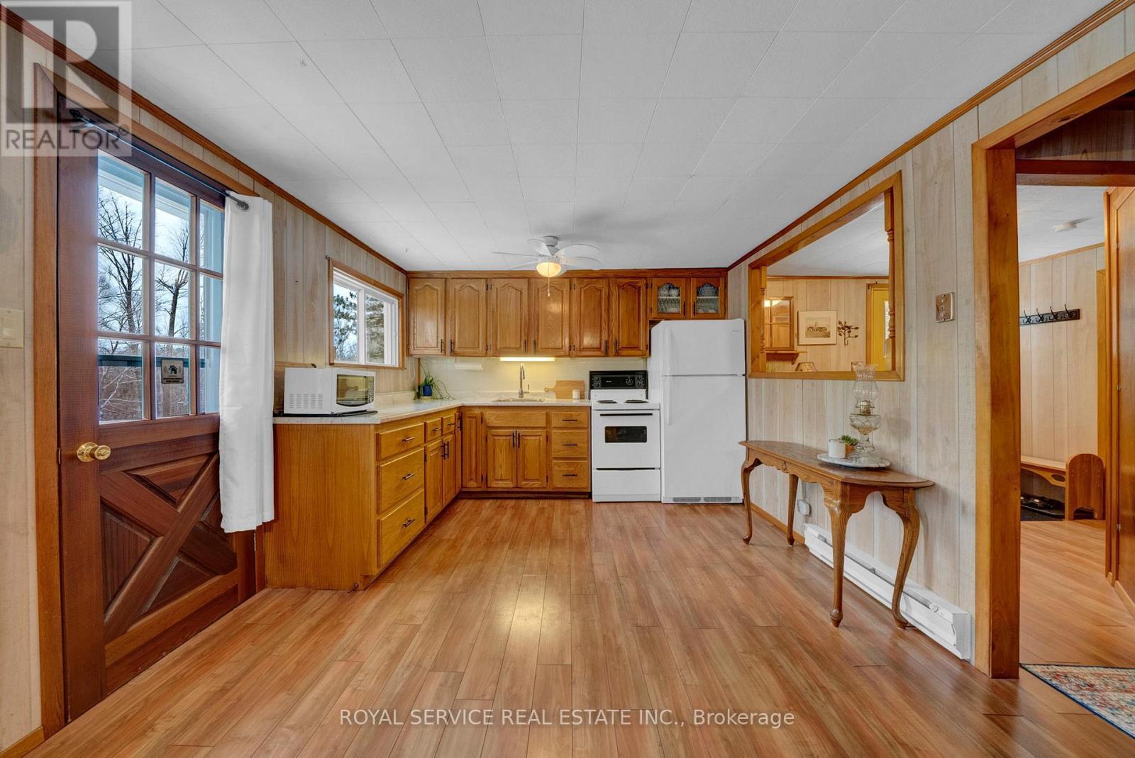 Large U Shaped Kitchen w/ Pass Thru - 1039 Grace River Road, Highlands East (Monmouth), ON - Indoor Photo Showing Kitchen
