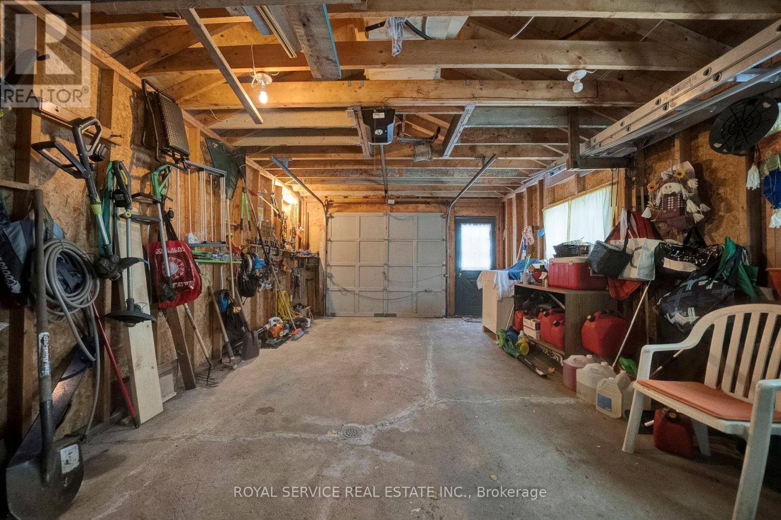 Inside the Garage, Lots of Storage & Room to Park! - 1039 Grace River Road, Highlands East (Monmouth), ON - Indoor Photo Showing Basement