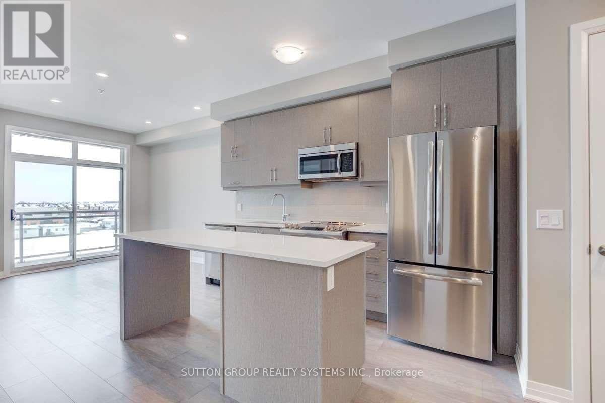 422 - 1105 Leger Way, Milton, ON - Indoor Photo Showing Kitchen With Stainless Steel Kitchen
