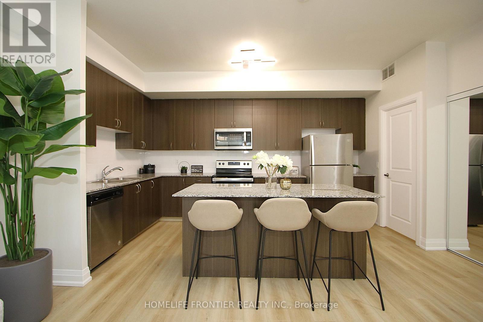 Kitchen + Breakfast - C1302 - 5299 Highway 7 Road, Vaughan, ON - Indoor Photo Showing Kitchen With Stainless Steel Kitchen With Double Sink With Upgraded Kitchen