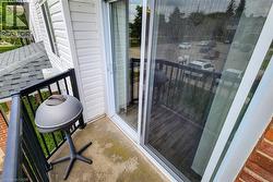 Balcony featuring area for grilling with BBQ -