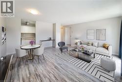 Staged: Large open living area with a wall unit AC -