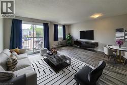 Staged: Large open living area with a wall unit AC -