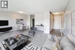 Staged: Large open living area with a wall unit AC -