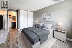 Staged: Large primary bedroom with large full height closet. -