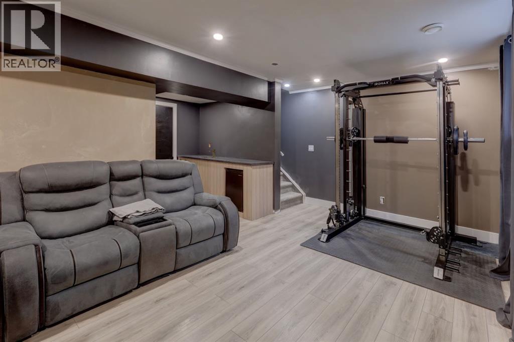 2238 Windbury Greenway Sw, Airdrie, AB - Indoor Photo Showing Gym Room