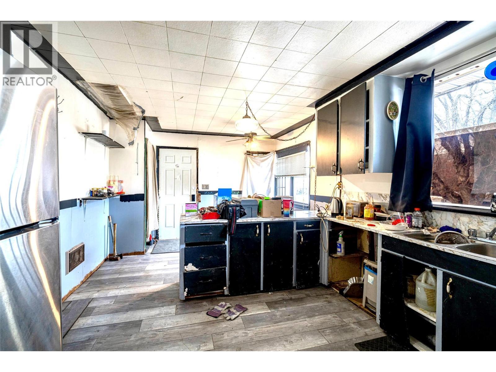 Kitchen looking towards back door of house - 2214 32 Street, Vernon, BC - Indoor