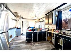 Kitchen looking towards back door of house -
