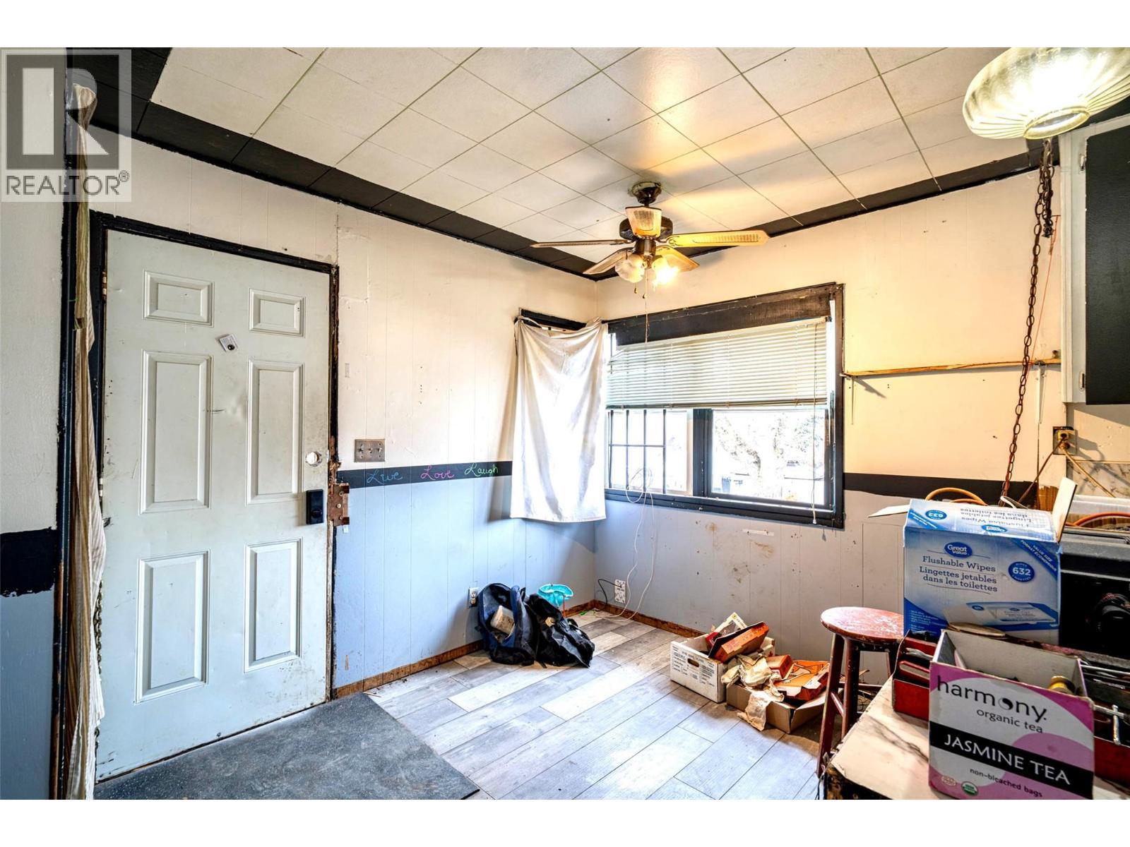 Dining area looking towards back door entry - 2214 32 Street, Vernon, BC - Indoor Photo Showing Other Room