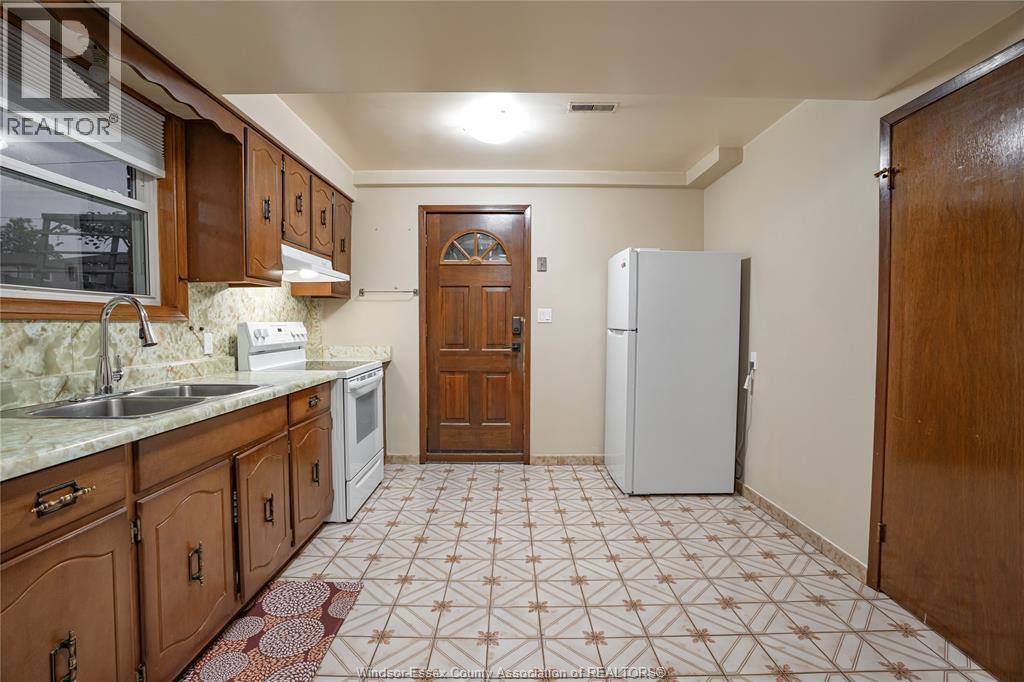 9610 Asgard Road, Windsor, ON - Indoor Photo Showing Kitchen With Double Sink