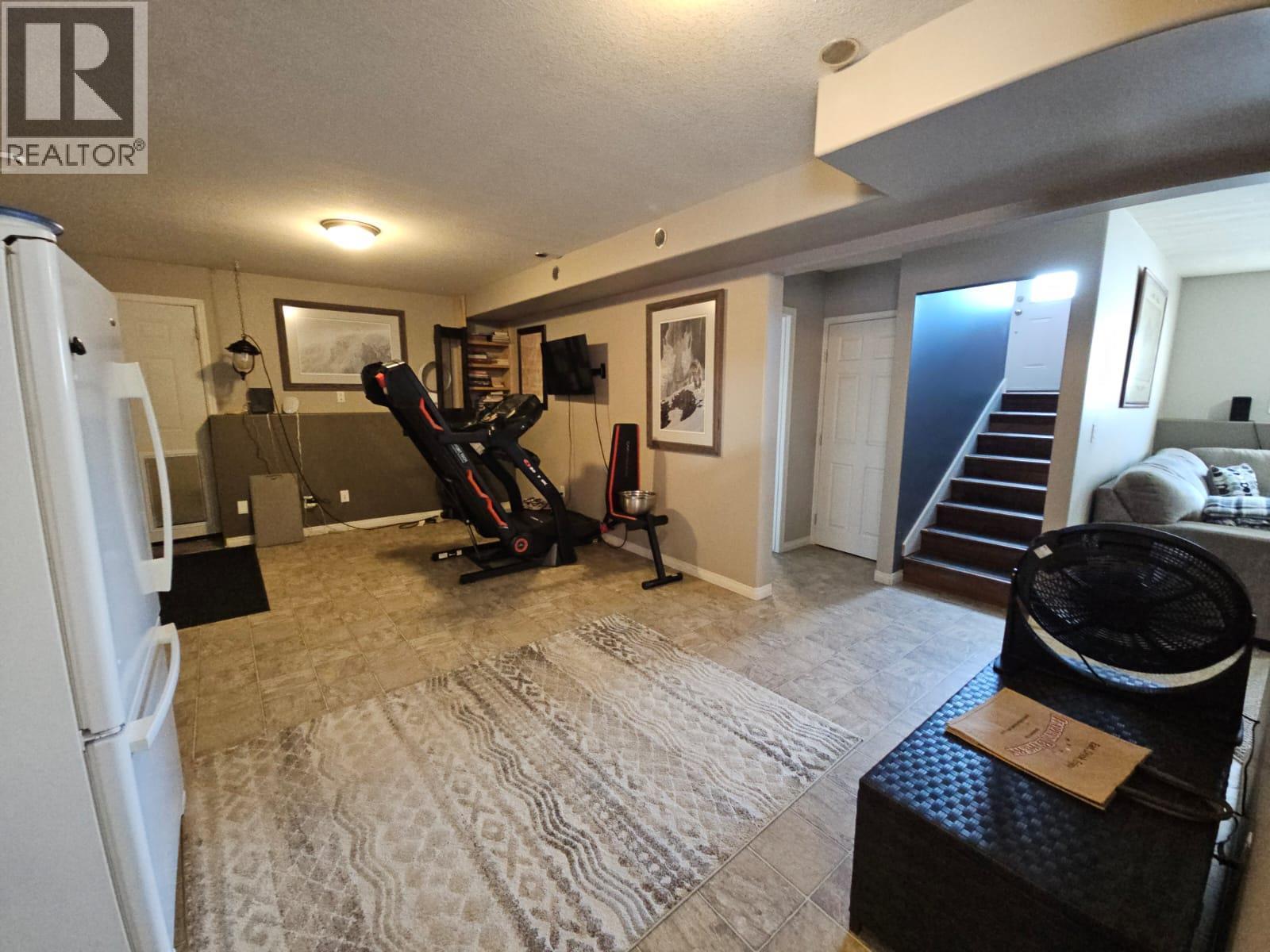 84 Wolverine Avenue, Tumbler Ridge, BC - Indoor Photo Showing Gym Room