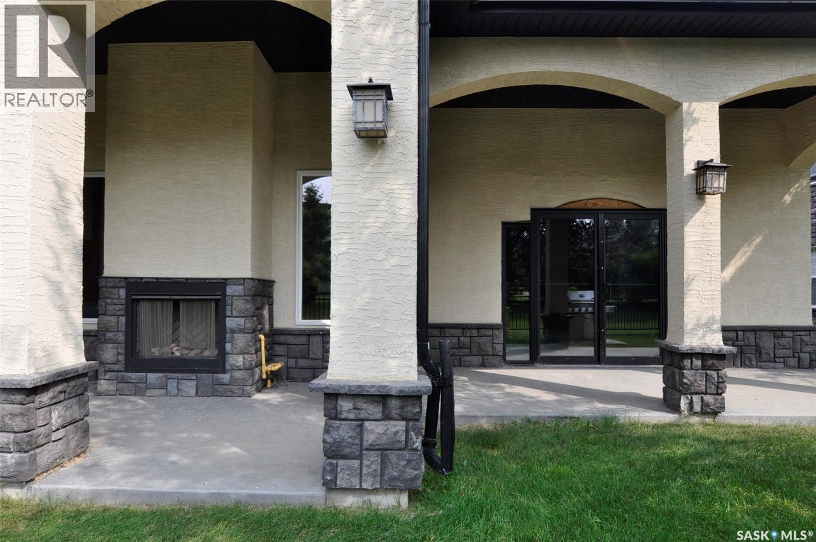 B107 415 Hunter Road, Saskatoon, SK - Outdoor With Fireplace