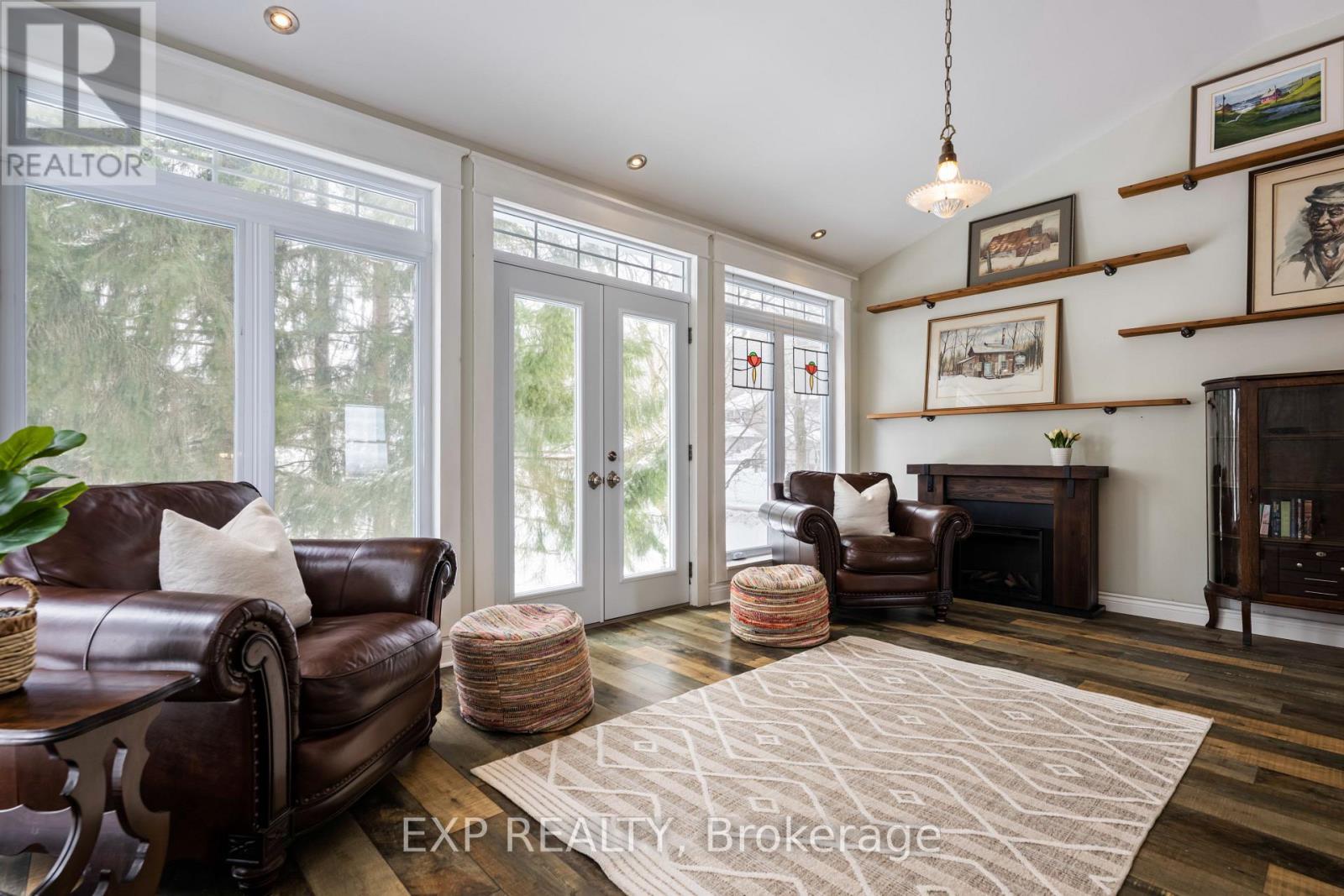 Primary Bedroom - 16 Mill Street, Amaranth, ON - Indoor Photo Showing Living Room With Fireplace
