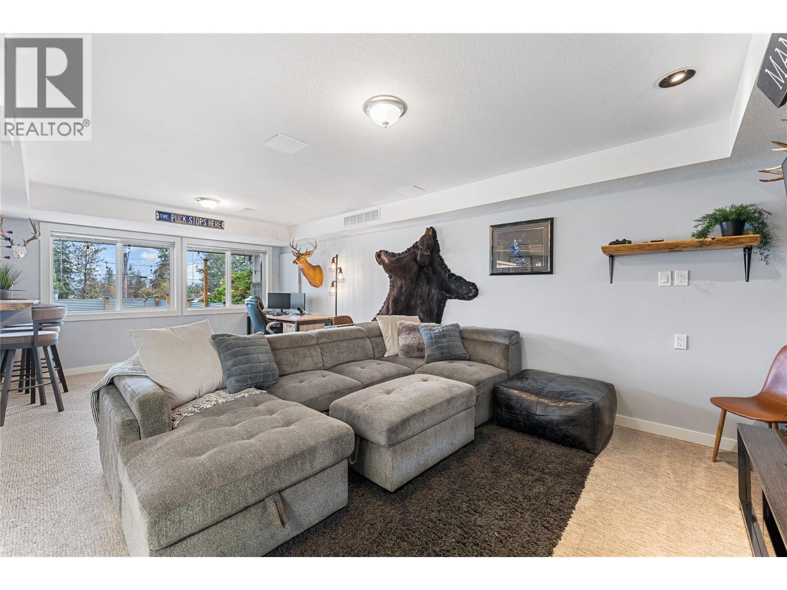 Huge rec room is bright with lots of options. - 3380 Mciver Road, West Kelowna, BC - Indoor Photo Showing Living Room