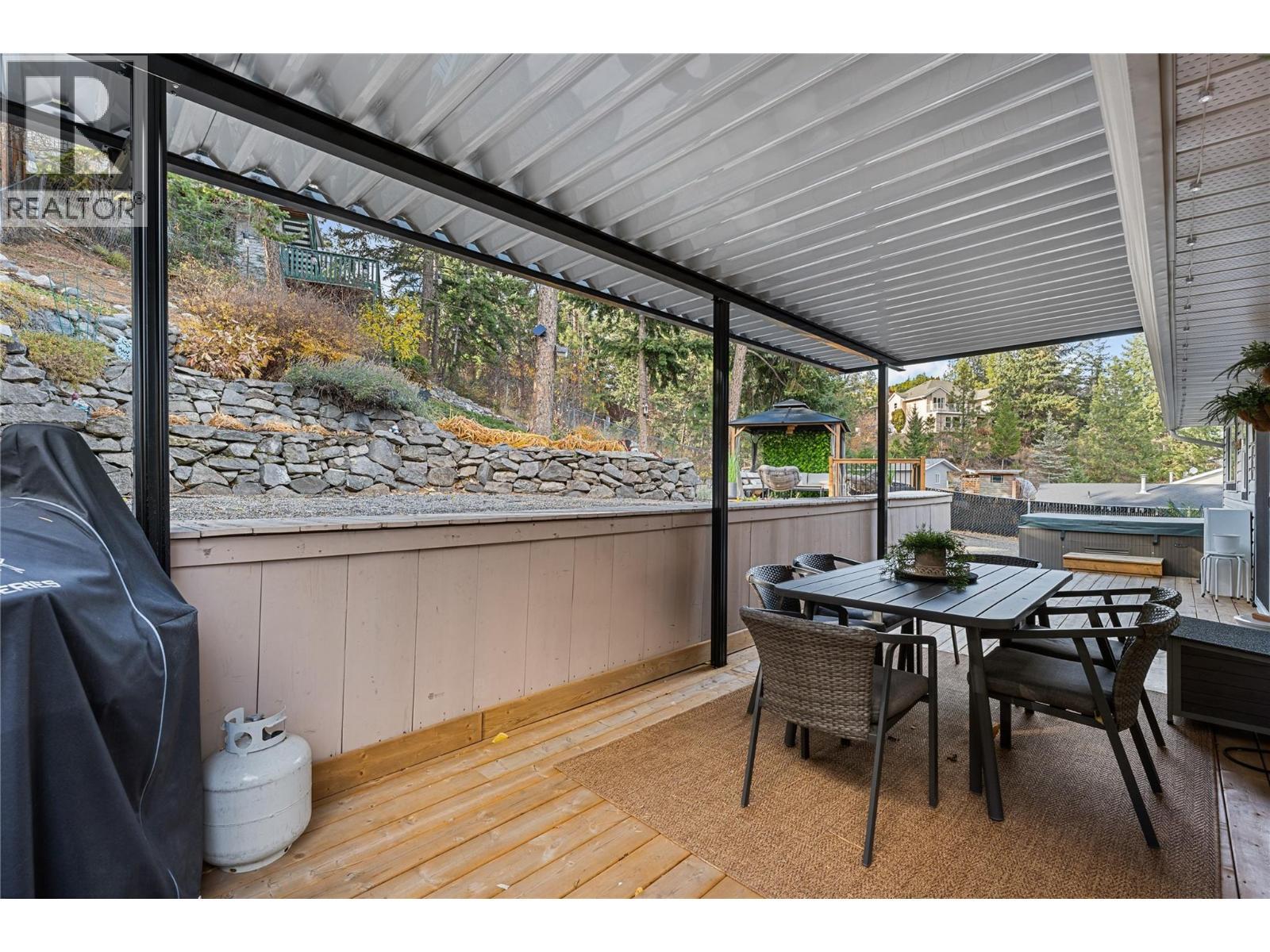 Covered deck provides outdoor flex space options. - 3380 Mciver Road, West Kelowna, BC - Outdoor With Deck Patio Veranda With Exterior