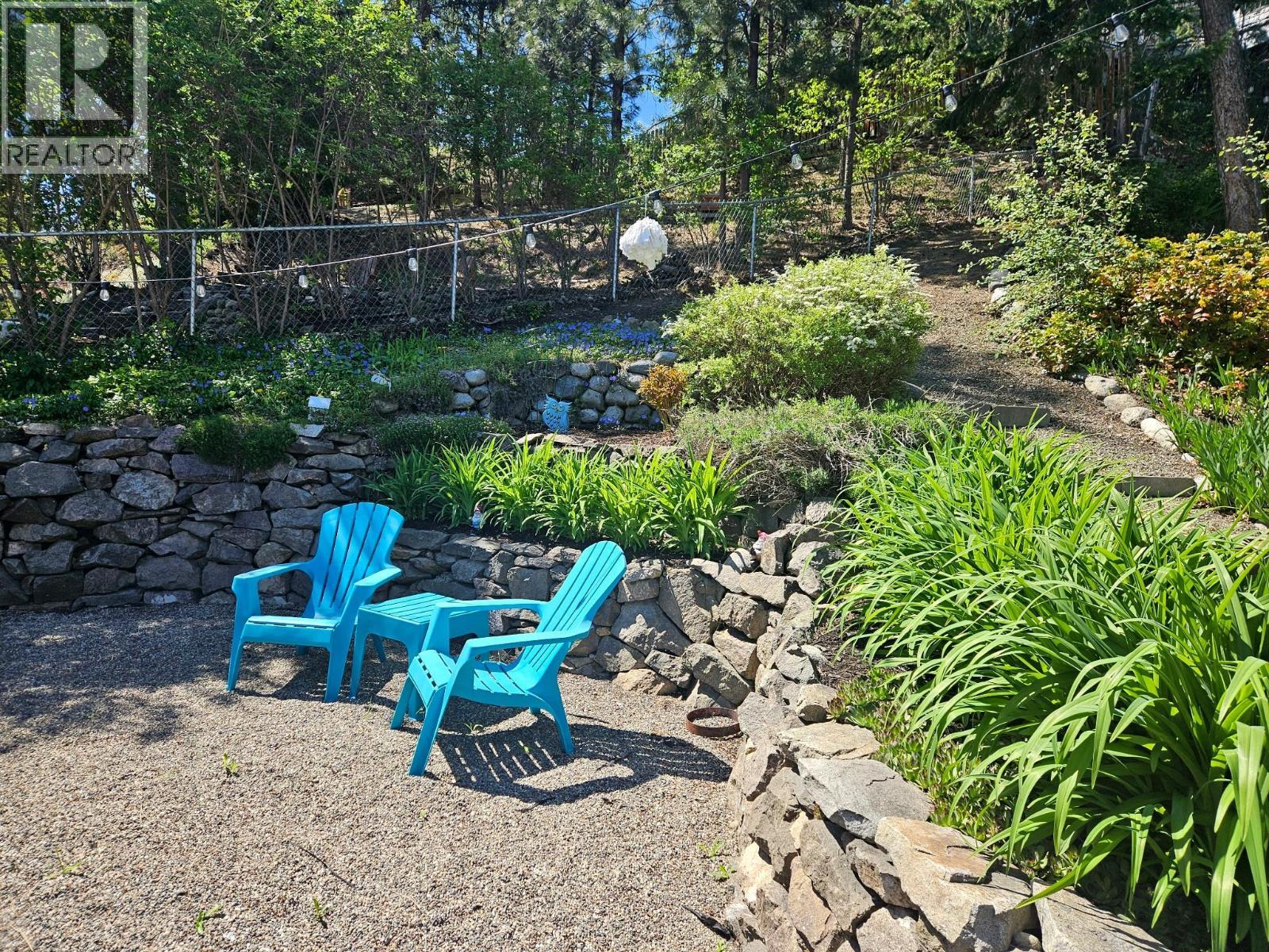 Summertime adds green and floral accents to the yard. - 3380 Mciver Road, West Kelowna, BC - Outdoor
