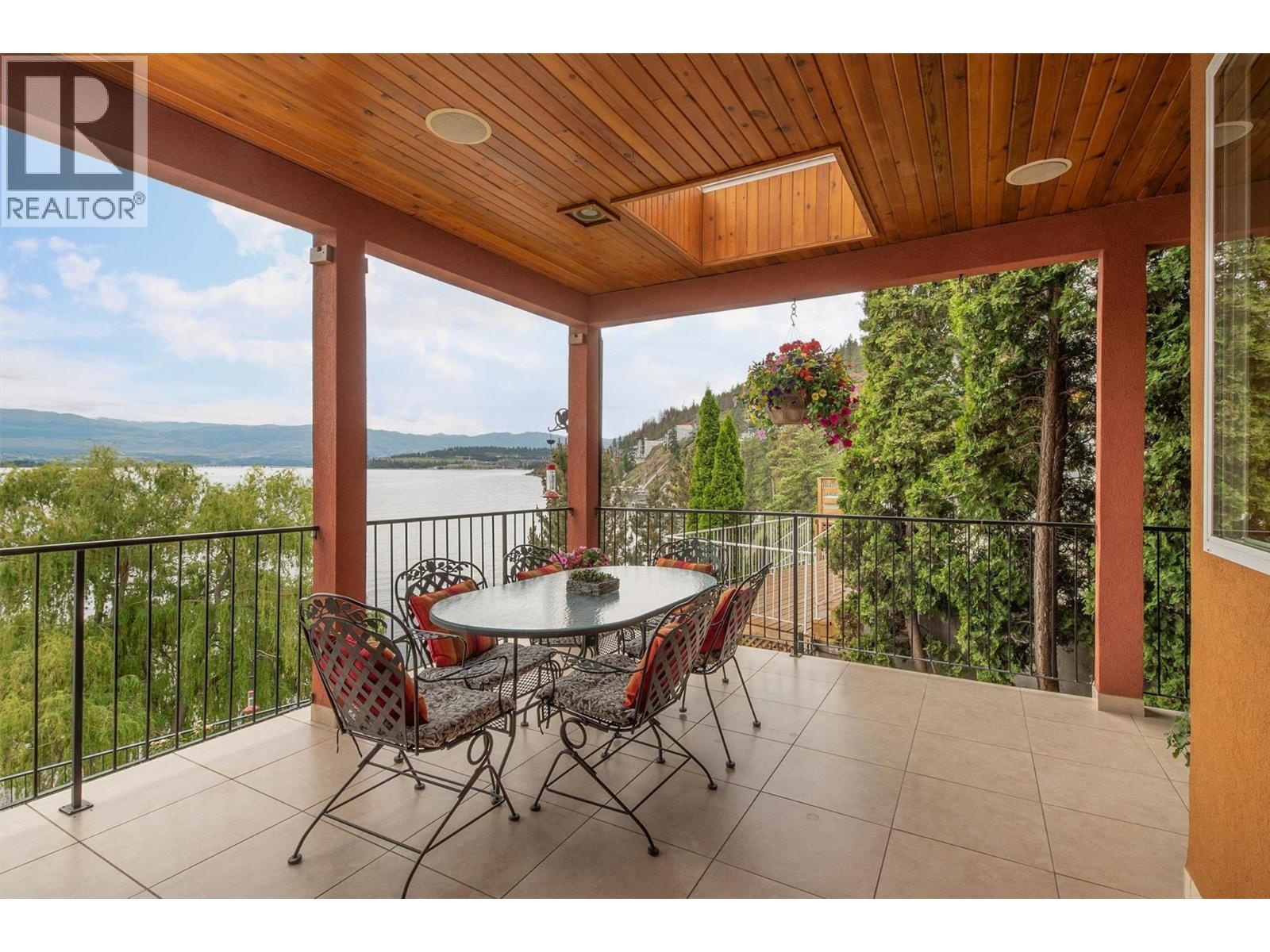 main floor patio off of dining room - 683 Westside Road S, West Kelowna, BC - Outdoor With Body Of Water With Deck Patio Veranda With View With Exterior