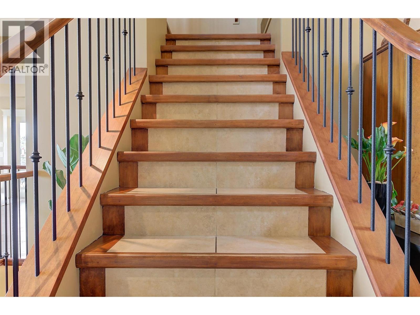 stairs up to primary suite - 683 Westside Road S, West Kelowna, BC - Indoor Photo Showing Other Room