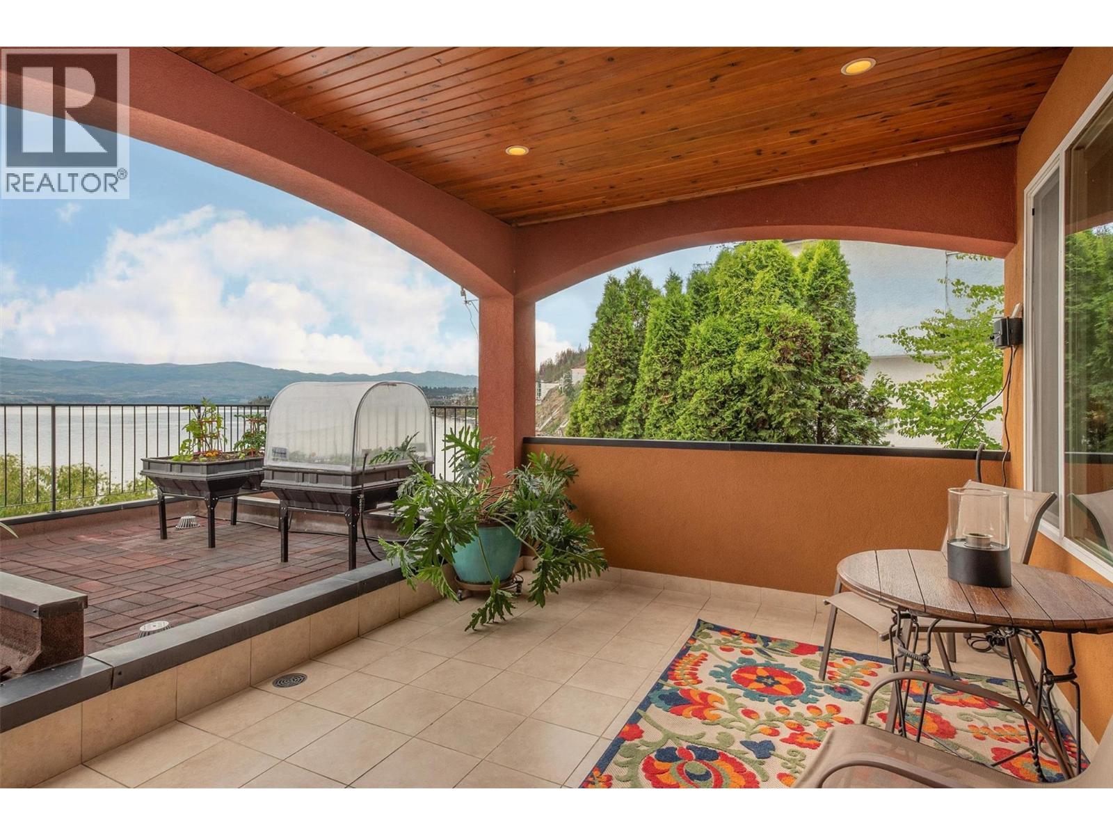 private patio from primary bedroom - 683 Westside Road S, West Kelowna, BC - Outdoor With Deck Patio Veranda With Exterior