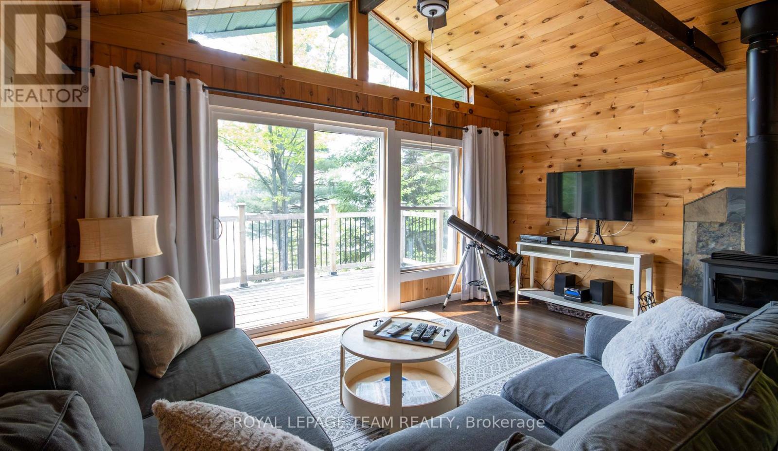 Lot 6 Burnt Island Island, Madawaska Valley, ON - Indoor Photo Showing Living Room With Fireplace