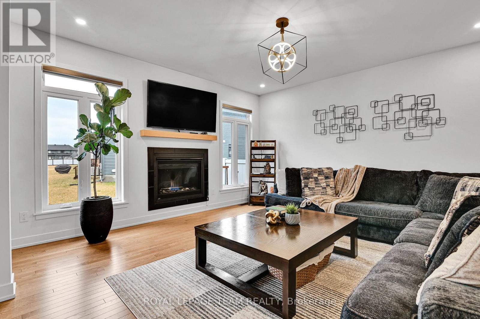 202 Zinnia Way, Ottawa, ON - Indoor Photo Showing Living Room With Fireplace