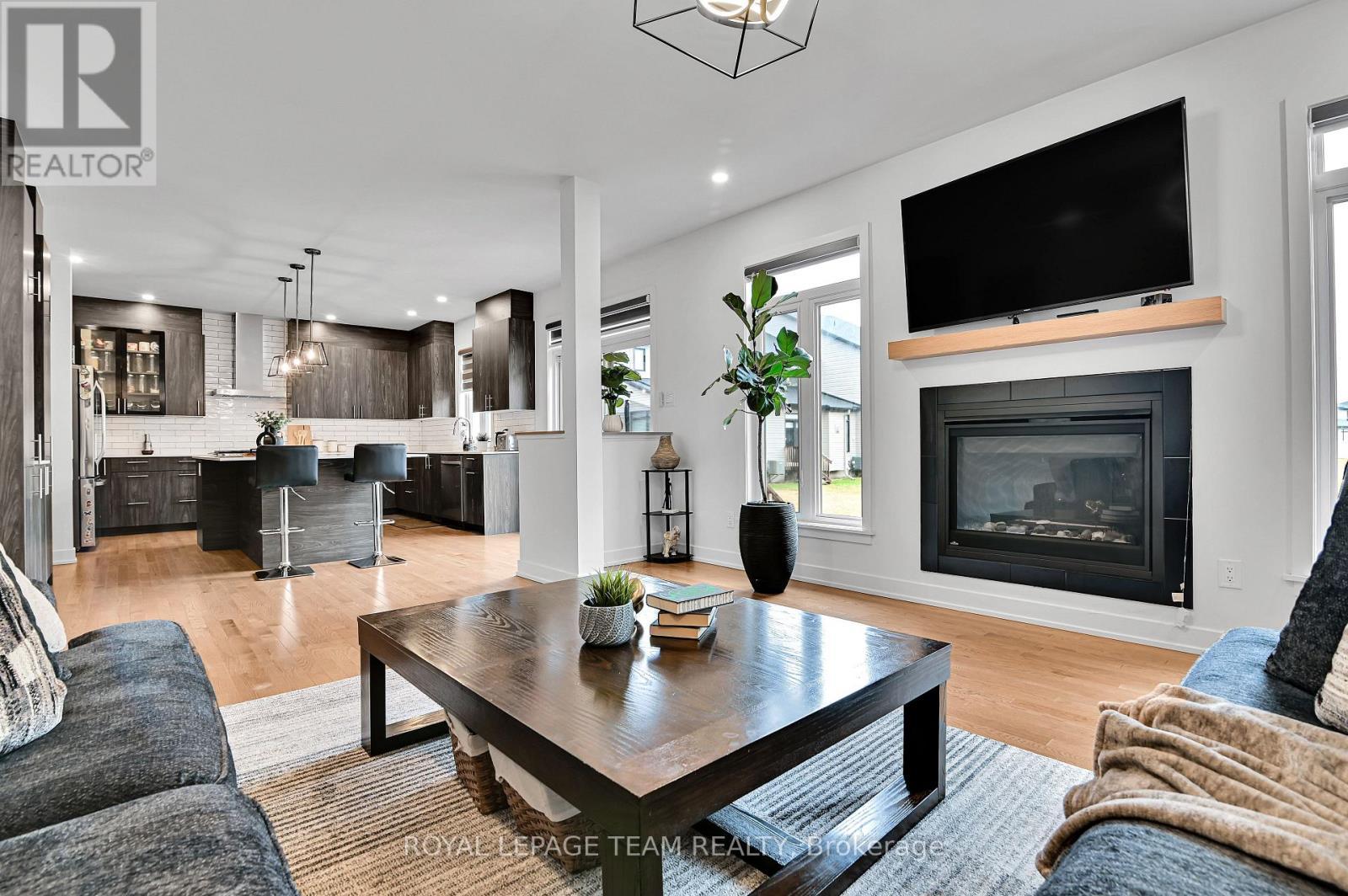 202 Zinnia Way, Ottawa, ON - Indoor Photo Showing Living Room With Fireplace