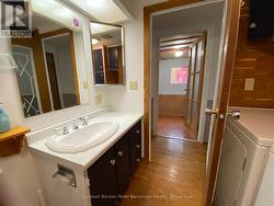 Bathroom includes washer and dryer. -