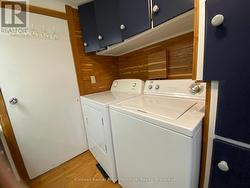 Washer and dryer in bathroom. -