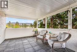 Large covered patio accessed from the main home upper level -
