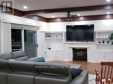 82 Laguna Parkway, Ramara, ON - Indoor Photo Showing Living Room With Fireplace