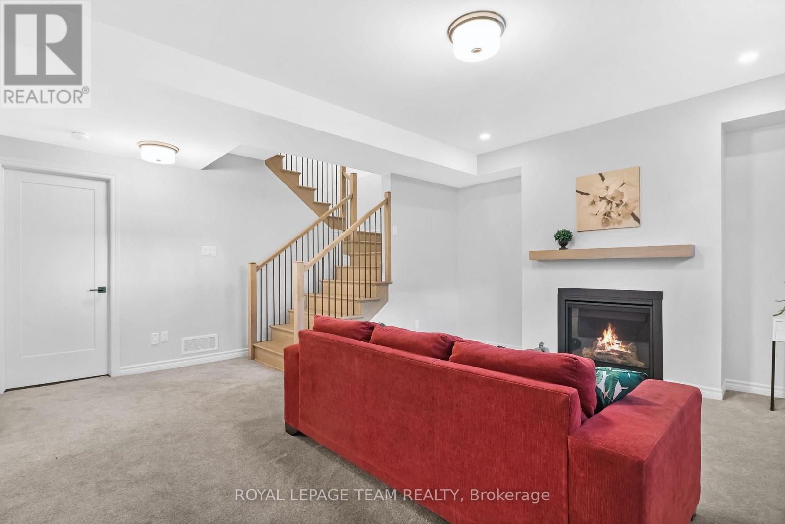 711 Moonflower Crescent, Ottawa, ON - Indoor Photo Showing Living Room With Fireplace