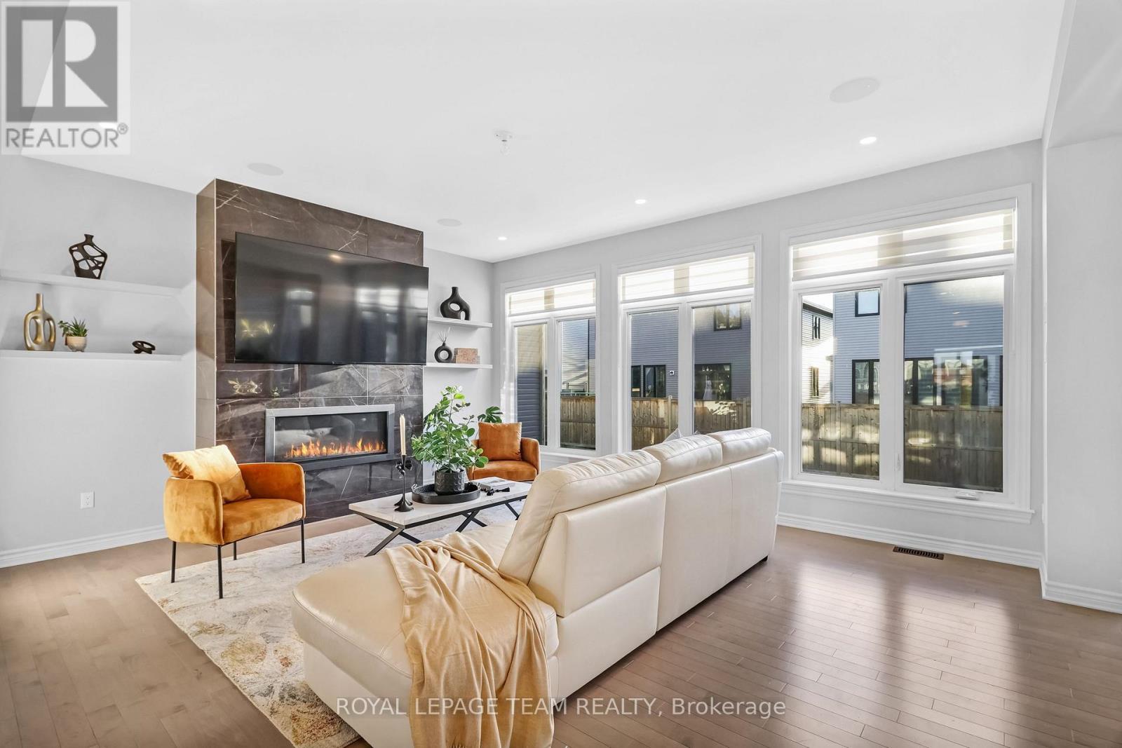 711 Moonflower Crescent, Ottawa, ON - Indoor Photo Showing Living Room With Fireplace