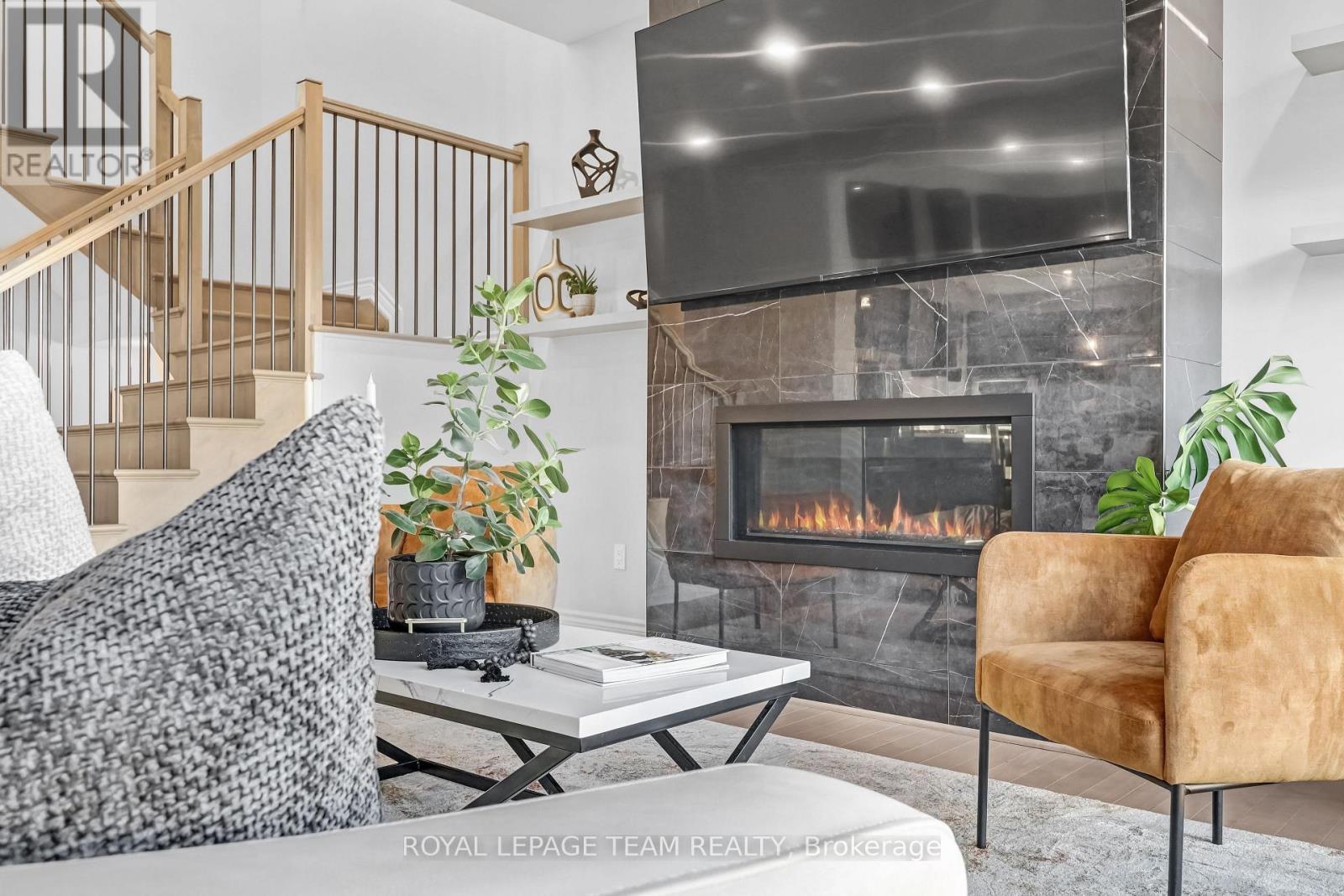 711 Moonflower Crescent, Ottawa, ON - Indoor Photo Showing Living Room With Fireplace