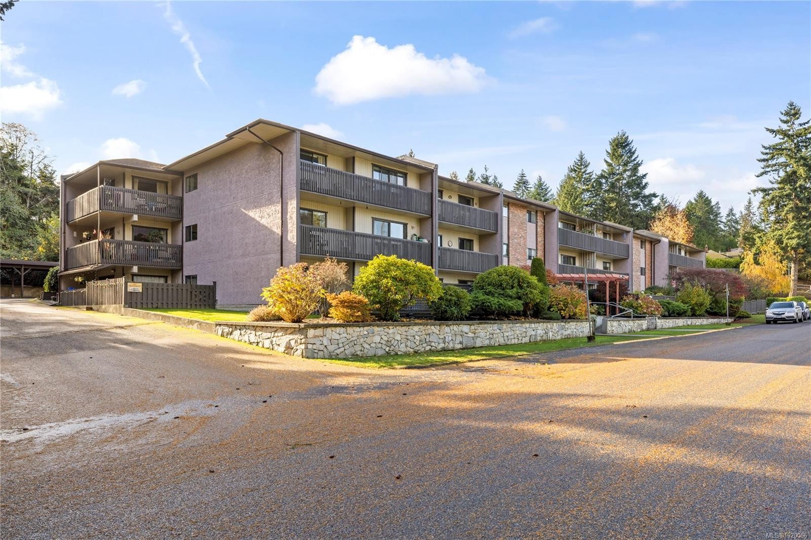 202-130 Sunningdale Rd East, Qualicum Beach, BC - Outdoor With Balcony With Facade
