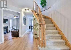 Bright foyer & curved staircase. -
