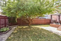 Fully fenced yard with mature trees. -