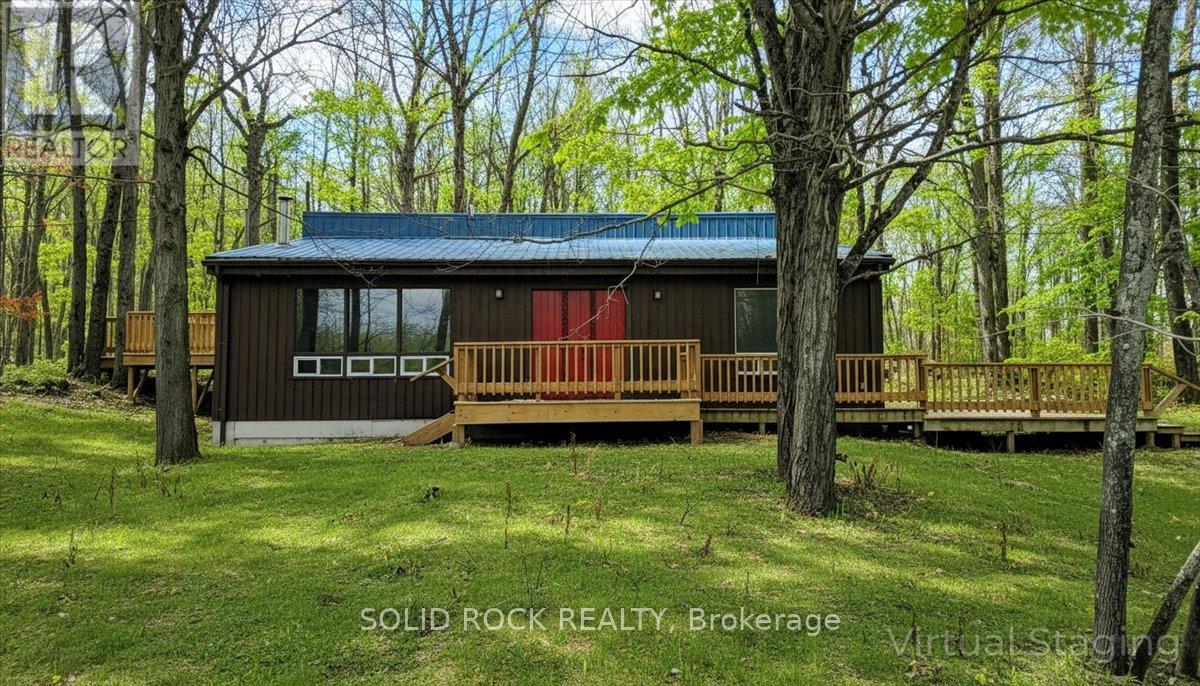 VIRTUALLY EDITED to show greenery - 132 Beaver Creek Road, Marmora And Lake (Marmora Ward), ON - Outdoor With Deck Patio Veranda