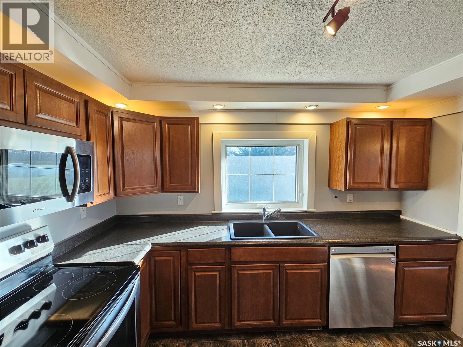 503 Souris Avenue E, Carlyle, SK - Indoor Photo Showing Kitchen With Double Sink