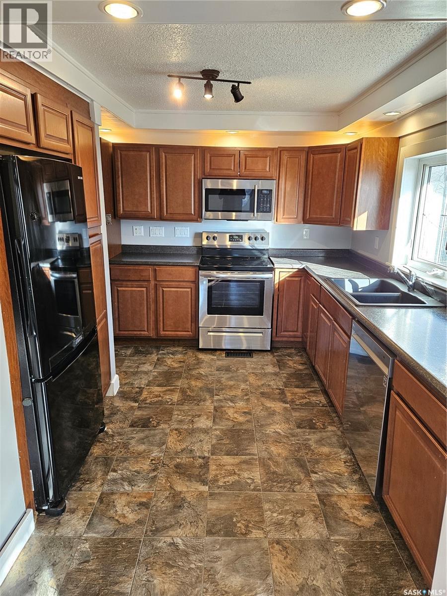 503 Souris Avenue E, Carlyle, SK - Indoor Photo Showing Kitchen With Double Sink
